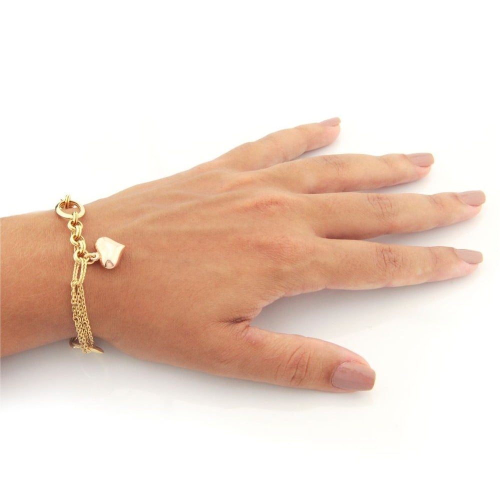 Pulseira de ouro 18k Feminina com pingente de coracao em ouro rose foto pulseira na mao 
