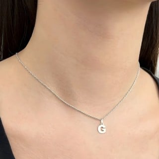Pingente letra G de ouro branco 18k